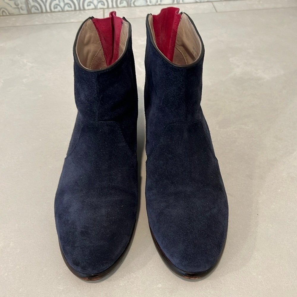 Biden, blue suede booties with pink lining.
